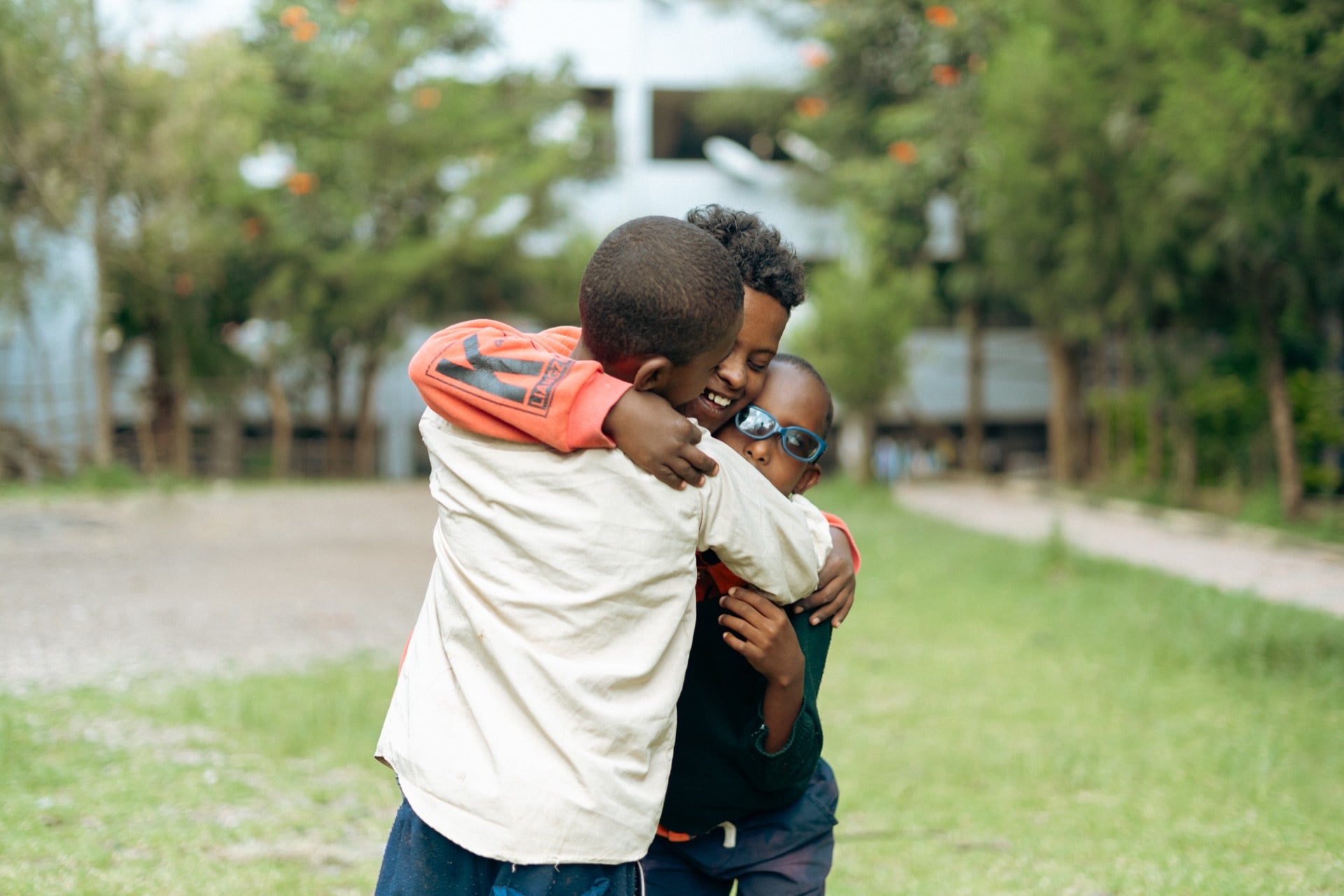 Two kids embracing each other